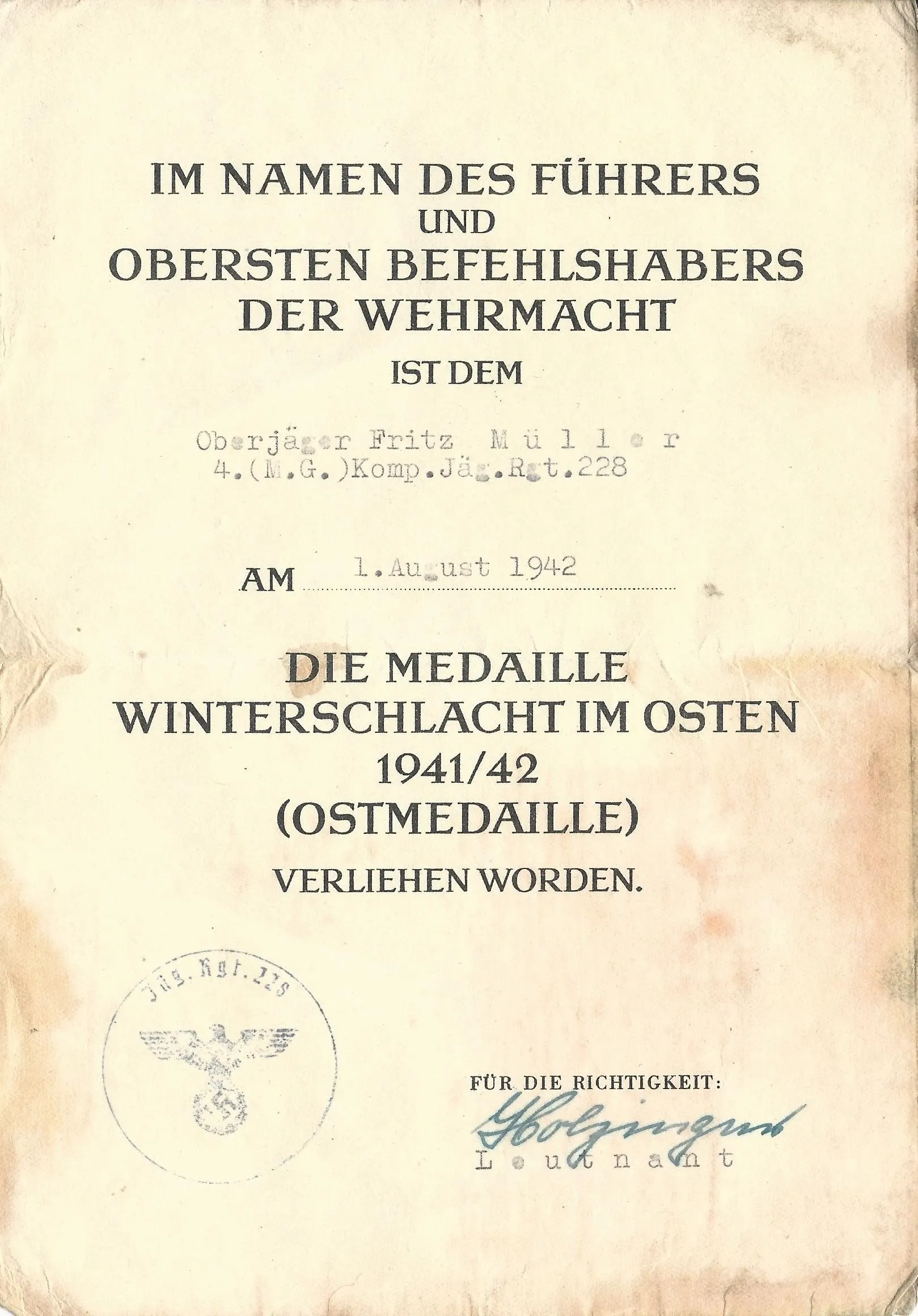 Original German WWII Eastern Front Medal with Award Document Dated 1942