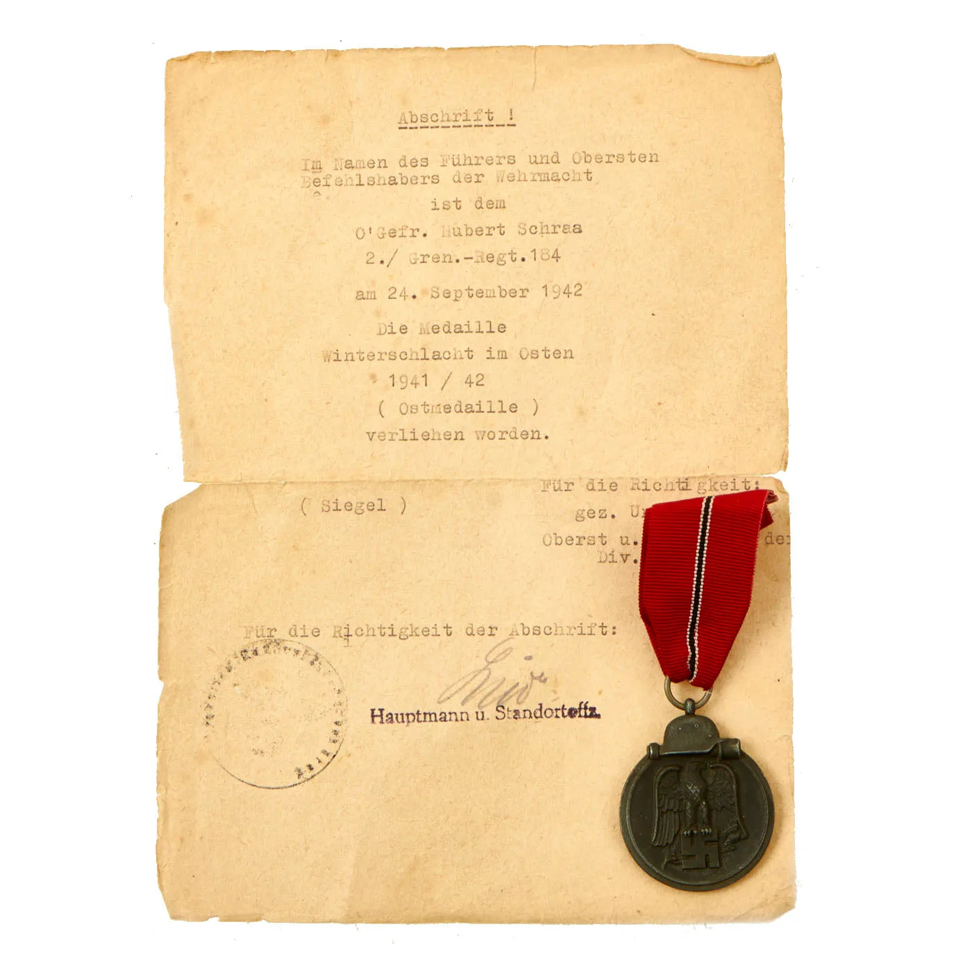 Original German WWII Eastern Front Medal with Named Typed Award Document Dated 1942